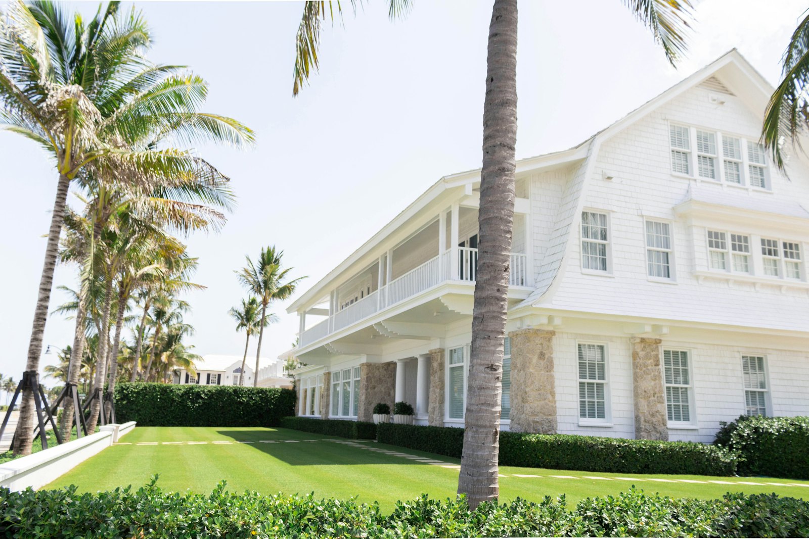 Coastal Florida home framed by palm trees